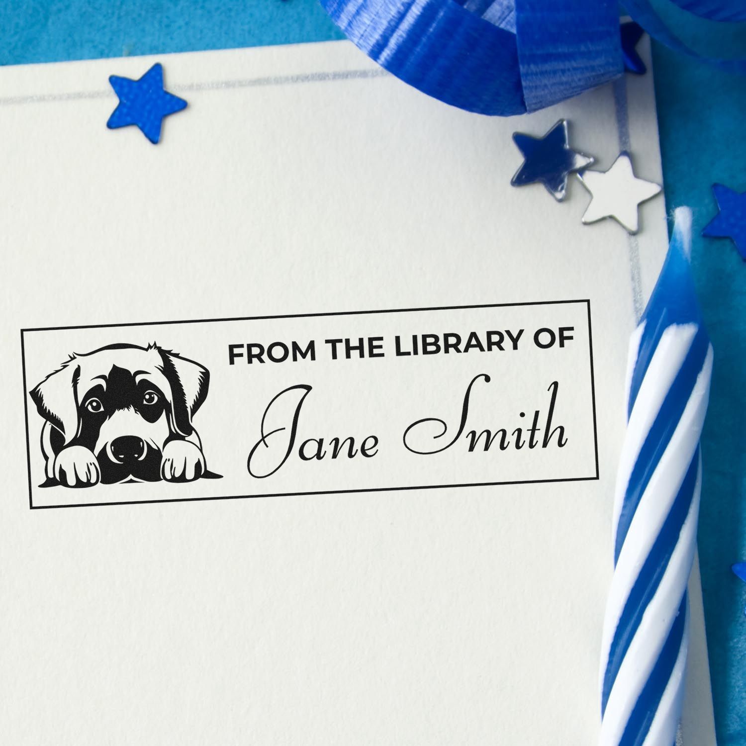 Personalized rubber stamp with dog illustration and From the Library of Jane Smith for marking books and library ownership.