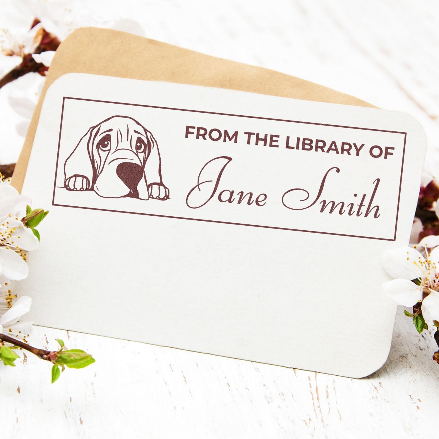Personalized rubber book stamp with dog design and From the Library of Jane Smith text for custom library books and bookplates.