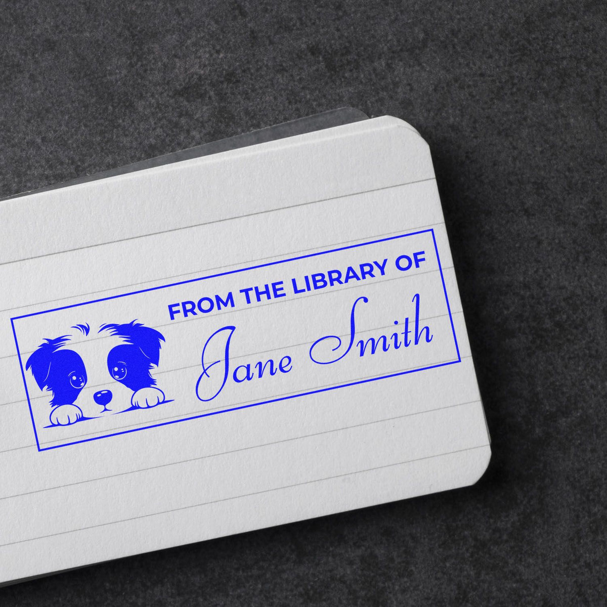 Custom rubber stamp with dog graphic and From the Library of Jane Smith for personal books, libraries, and book lovers.