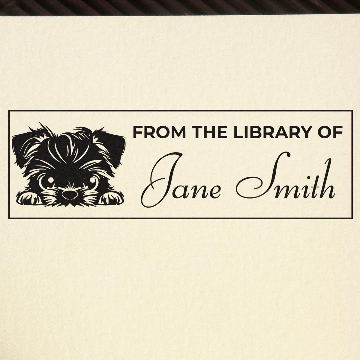 Personalized library rubber stamp with dog illustration and From the Library of Jane Smith text.