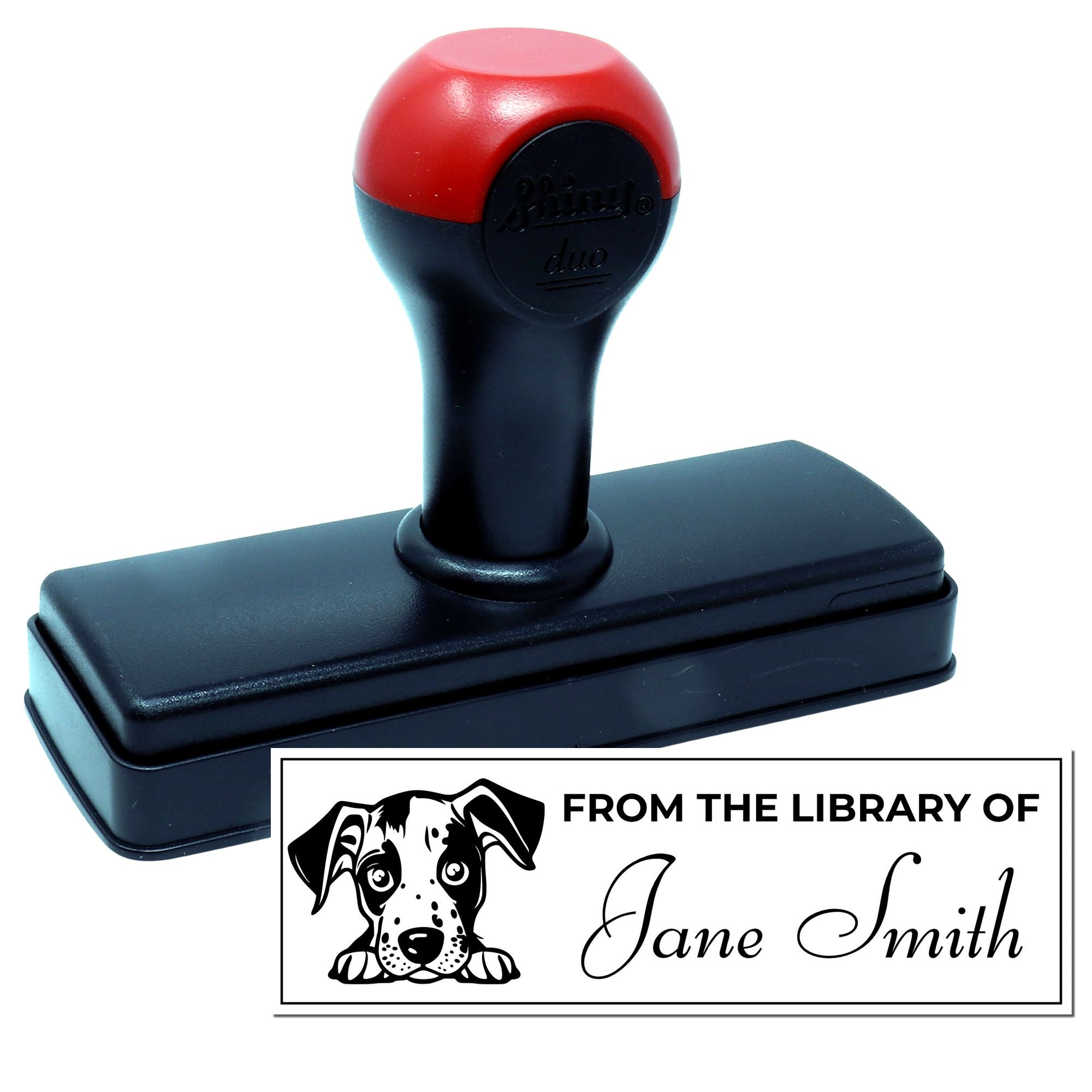 Self-inking custom rubber stamp for personalized From the Library of book labels with dog design.