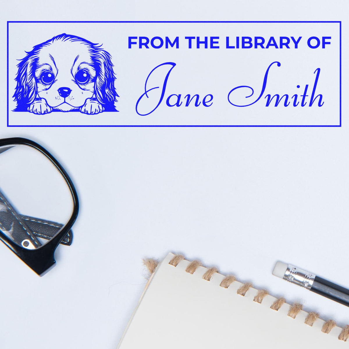 Personalized library rubber stamp with dog illustration and From the Library of Jane Smith custom book ownership text.