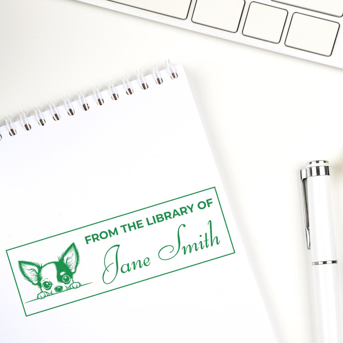 Custom library rubber stamp impression with dog design and Jane Smith name on notebook page, ideal for book lovers.