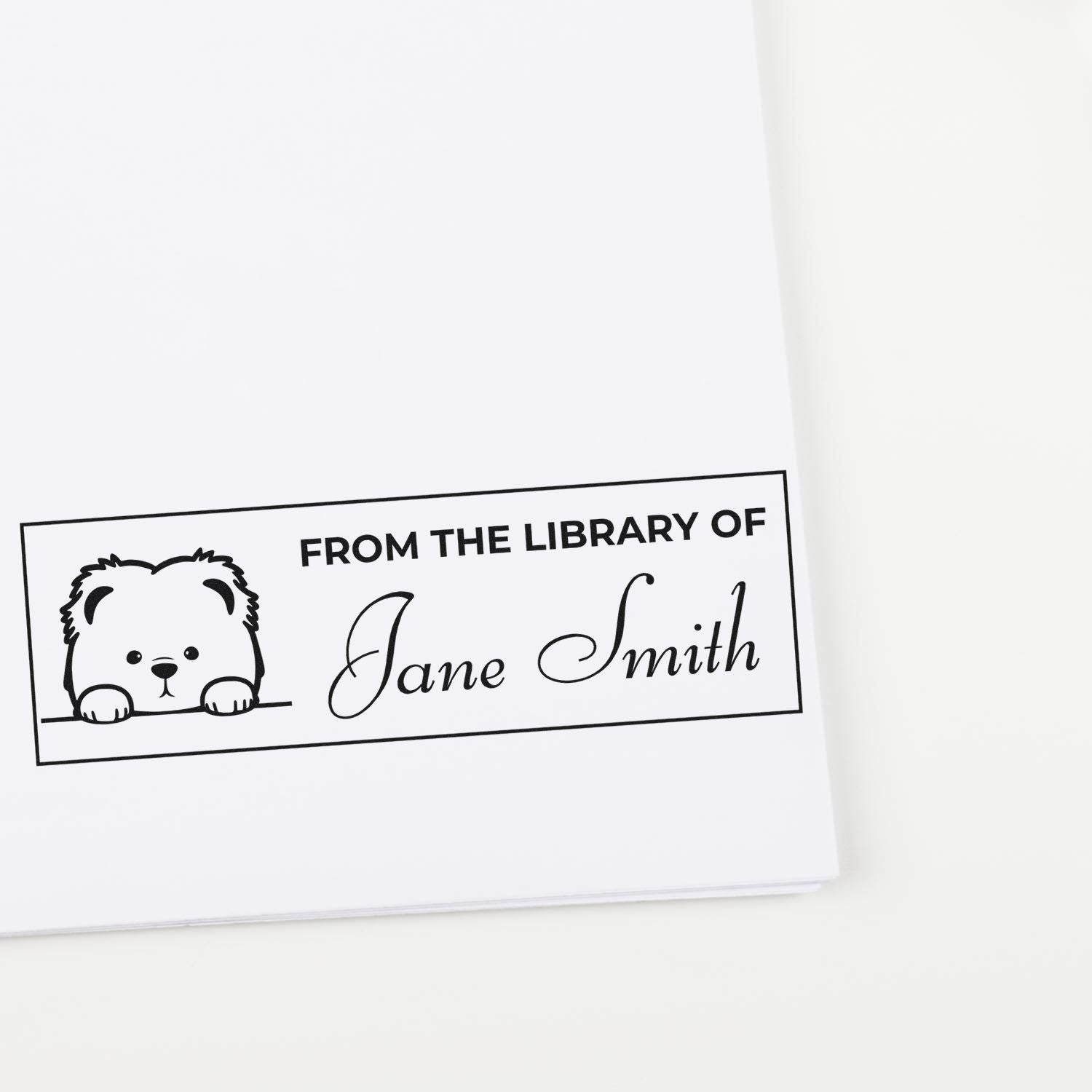 Personalized library rubber stamp with bear bookplate design reading From the Library of Jane Smith for custom book labeling.