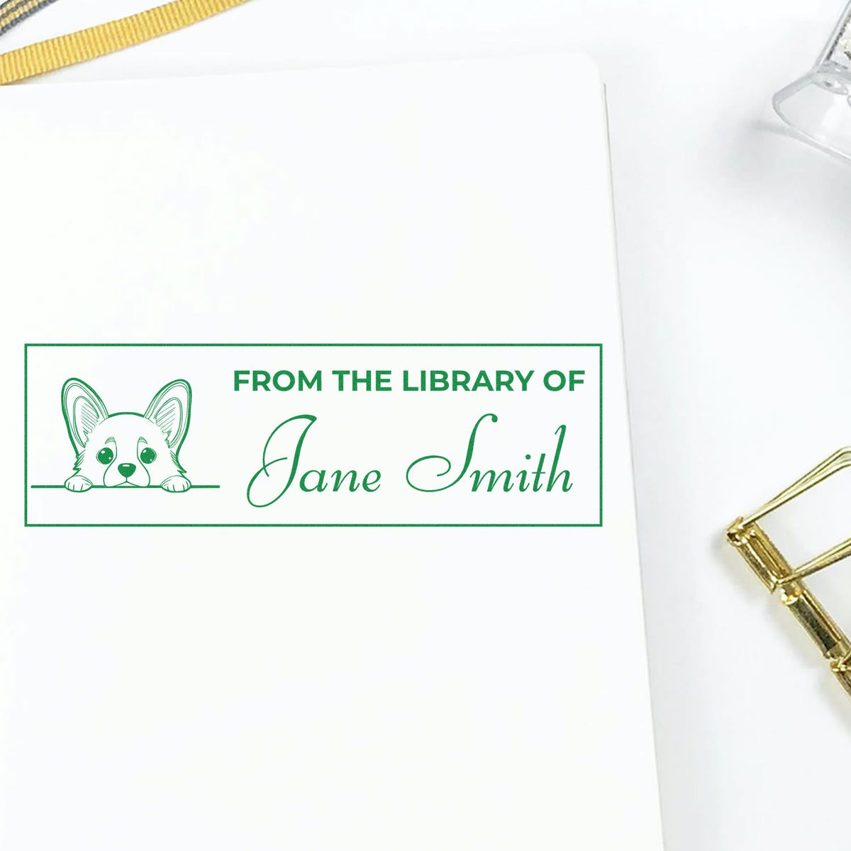 Personalized library rubber stamp for Jane Smith with dog illustration, marking book ownership.