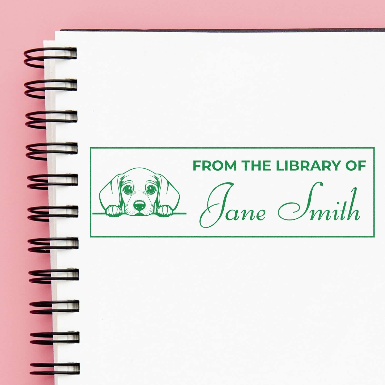Custom personalized library rubber stamp reading From the Library of Jane Smith with dog illustration for book ownership.