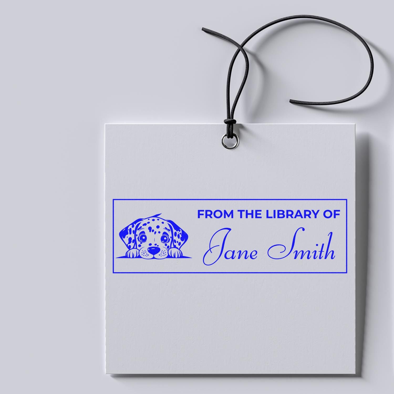 Personalized rubber book stamp with dog illustration, From the Library of Jane Smith custom library ownership mark.