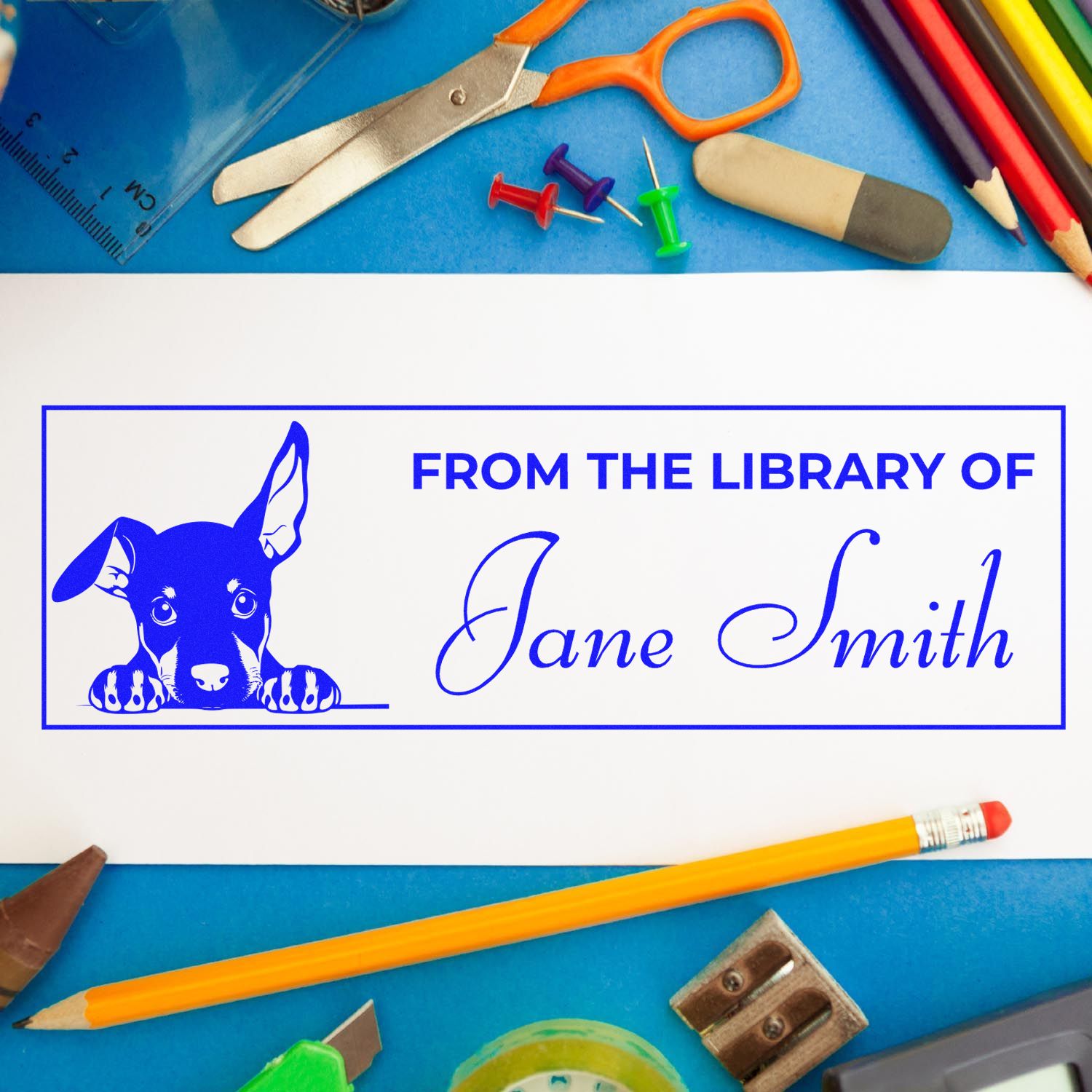 Custom rubber stamp design reading From the Library of Jane Smith with dog motif for personalized book and library stamps.