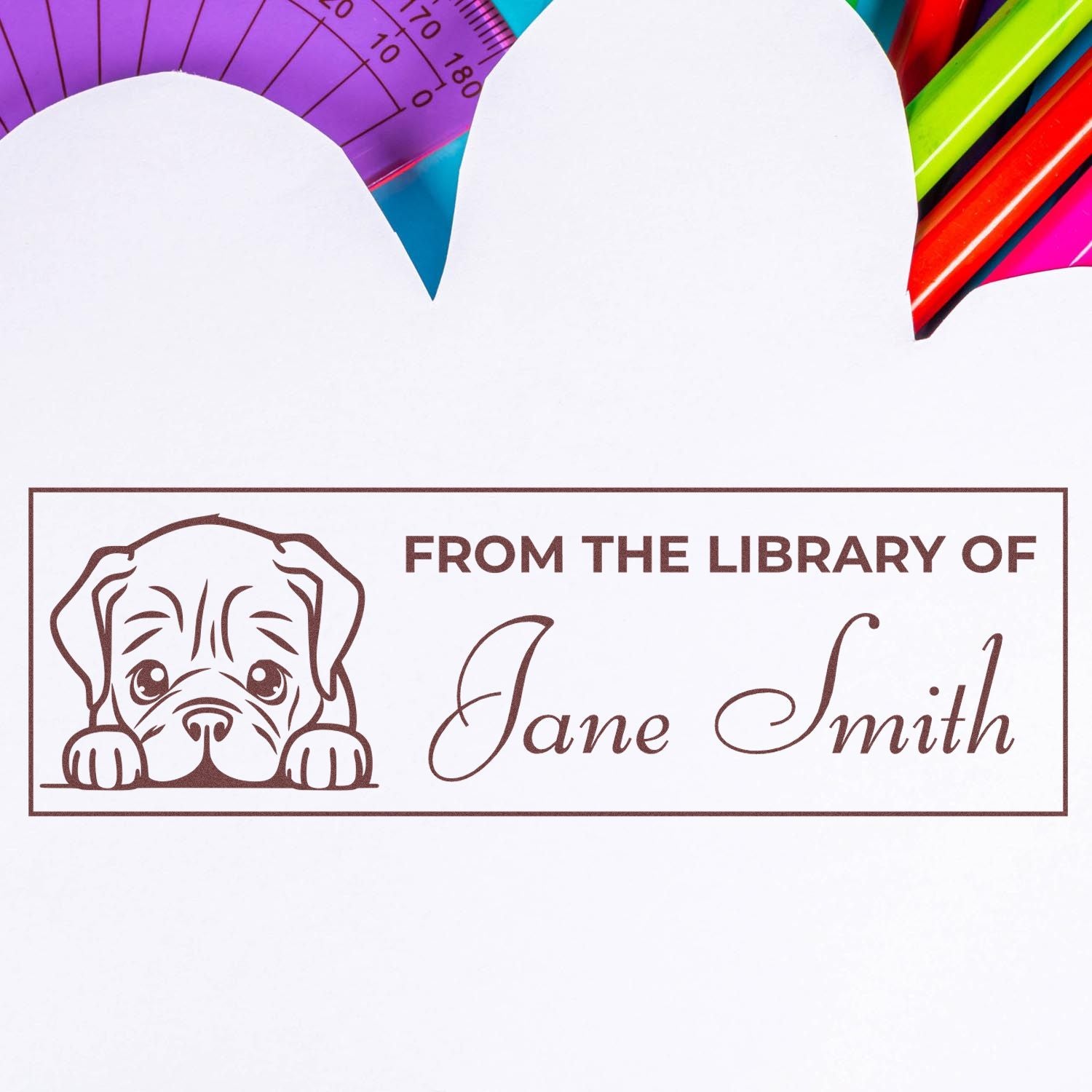 Personalized rubber library stamp with puppy design and From the Library of Jane Smith for book ownership labeling.