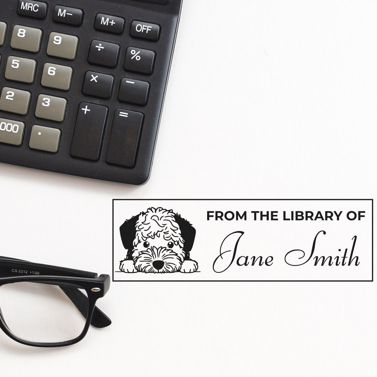 Custom rubber stamp with dog design and From the Library of Jane Smith for personalized bookplates and library labels.