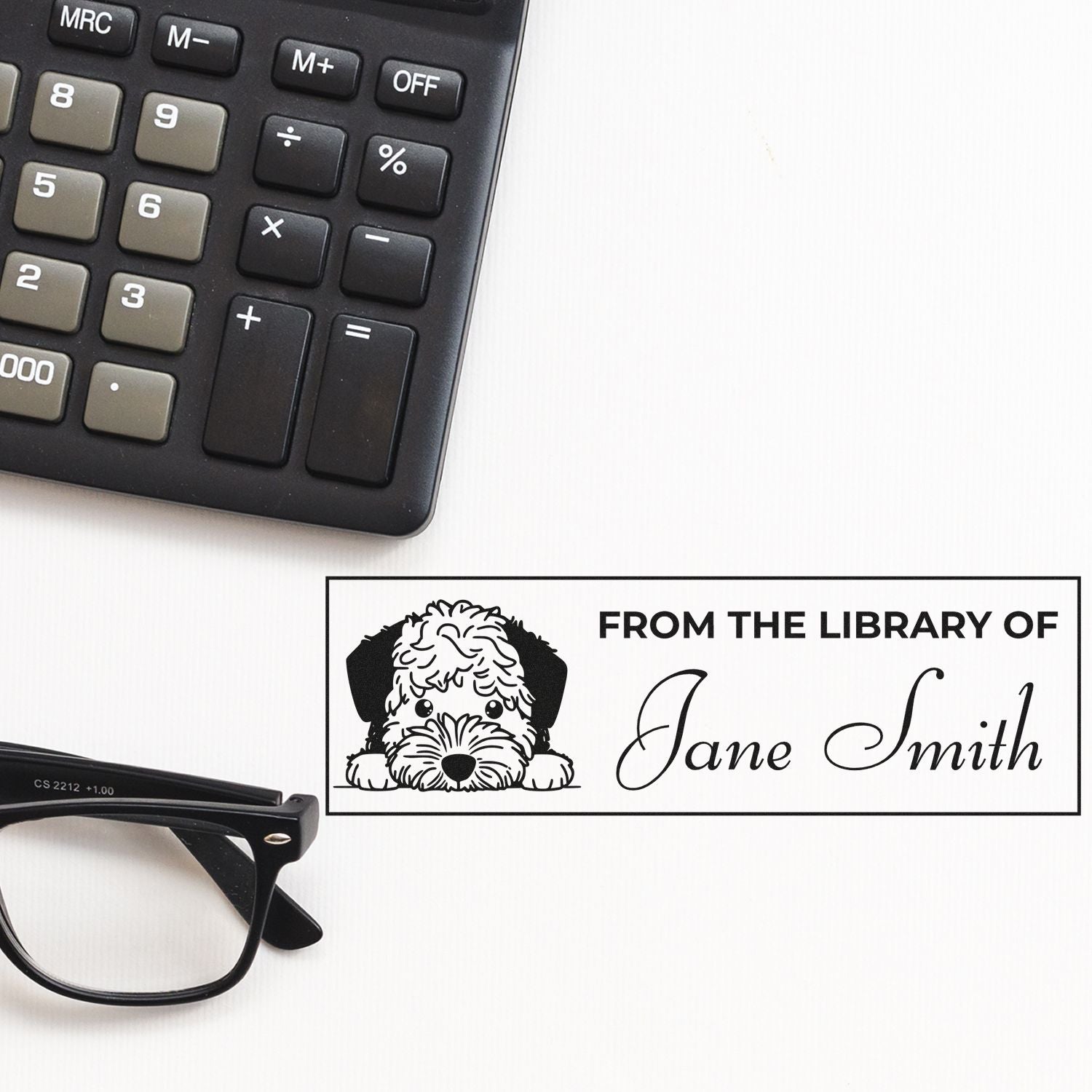 Custom rubber library book stamp for Jane Smith with dog illustration, perfect for personalizing books and stationery.