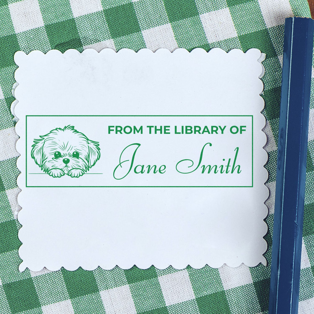 Personalized custom library rubber stamp with dog illustration and From the Library of Jane Smith for book labeling.