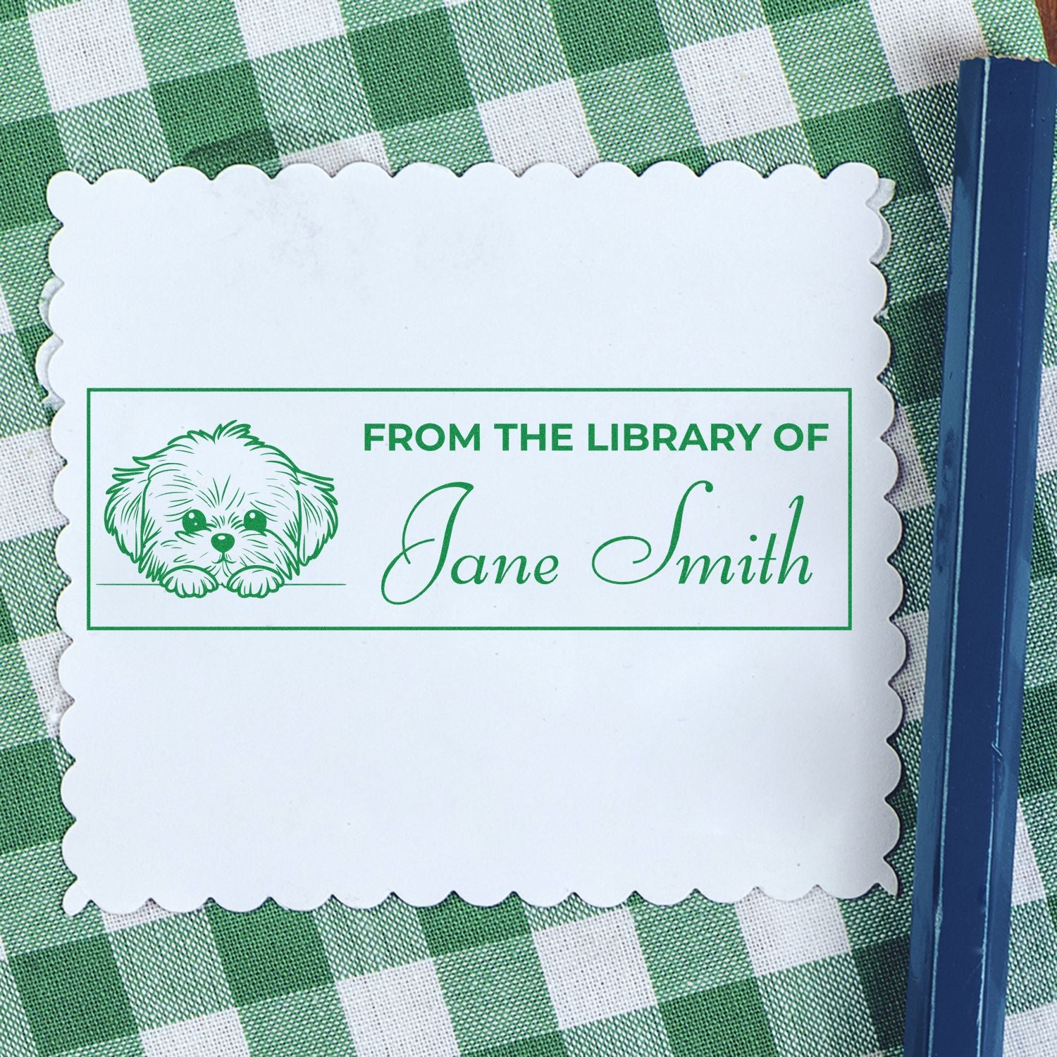 Personalized rubber stamp reading From the Library of Jane Smith with dog icon for custom bookplate labels.