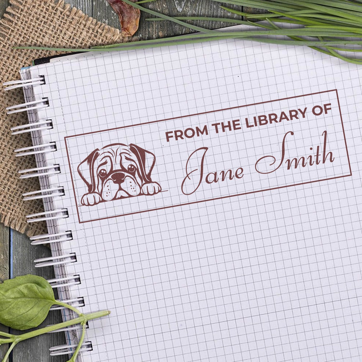Custom ex libris rubber stamp with dog design, reading From the Library of Jane Smith for books and notebooks.
