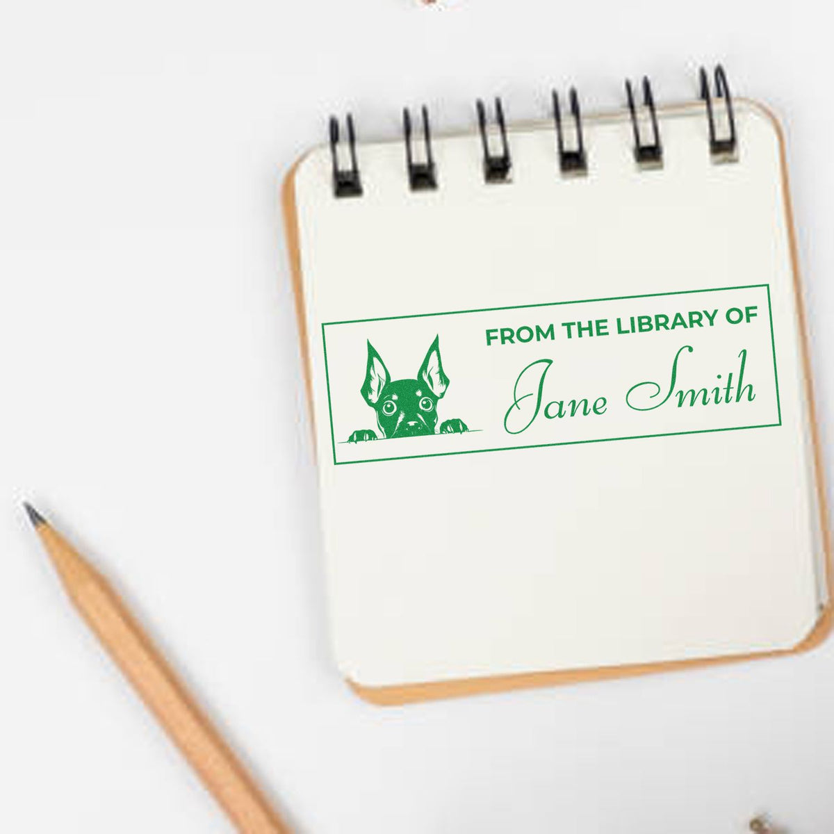 Personalized bookplate rubber stamp with dog design and From the Library of Jane Smith text.