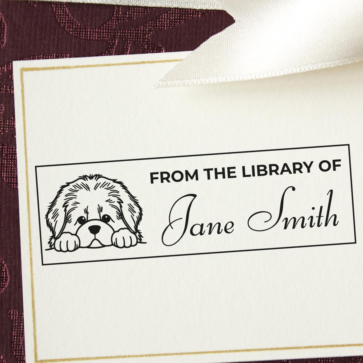 Personalized rubber stamp with dog illustration and From the Library of Jane Smith for books and stationery.