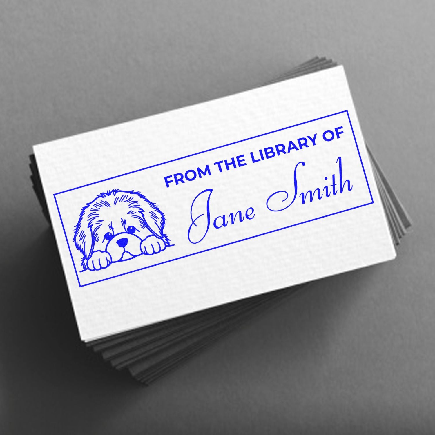Custom library rubber stamp for books, featuring a dog illustration and From the Library of Jane Smith text.