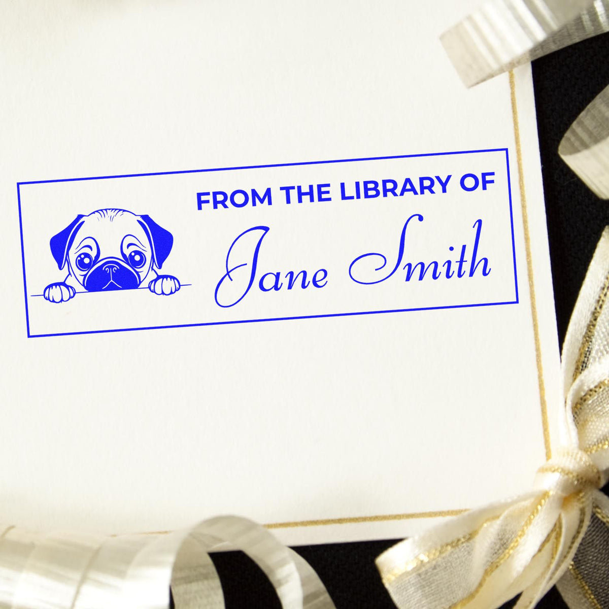 Custom library rubber stamp with pug illustration and From the Library of Jane Smith for personal book labeling.
