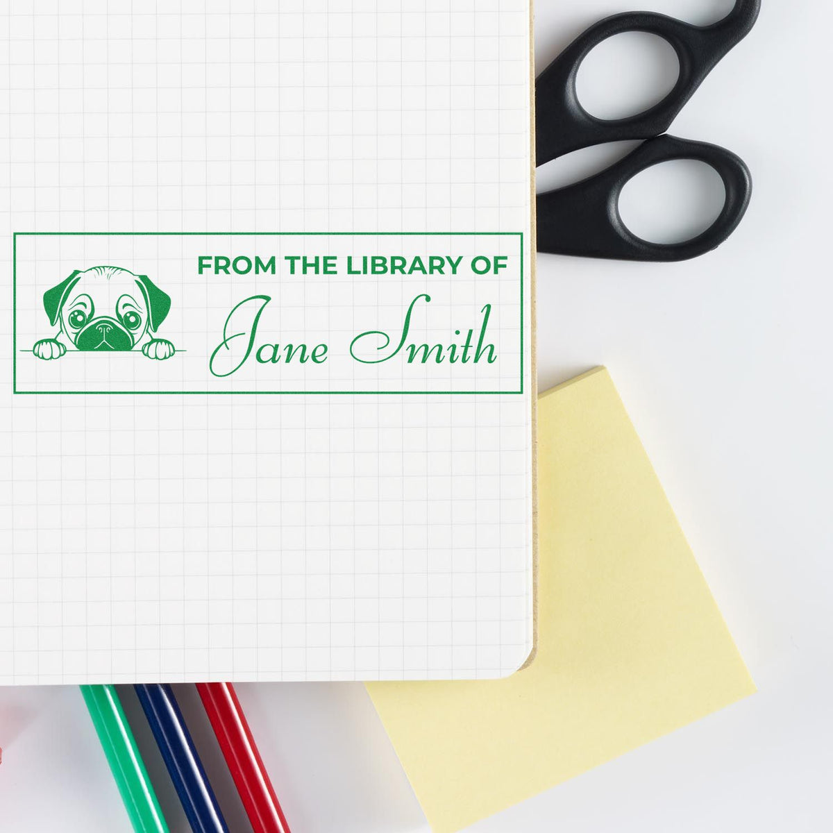 Personalized library rubber stamp with dog logo and Jane Smith name, used to label books and notebooks.