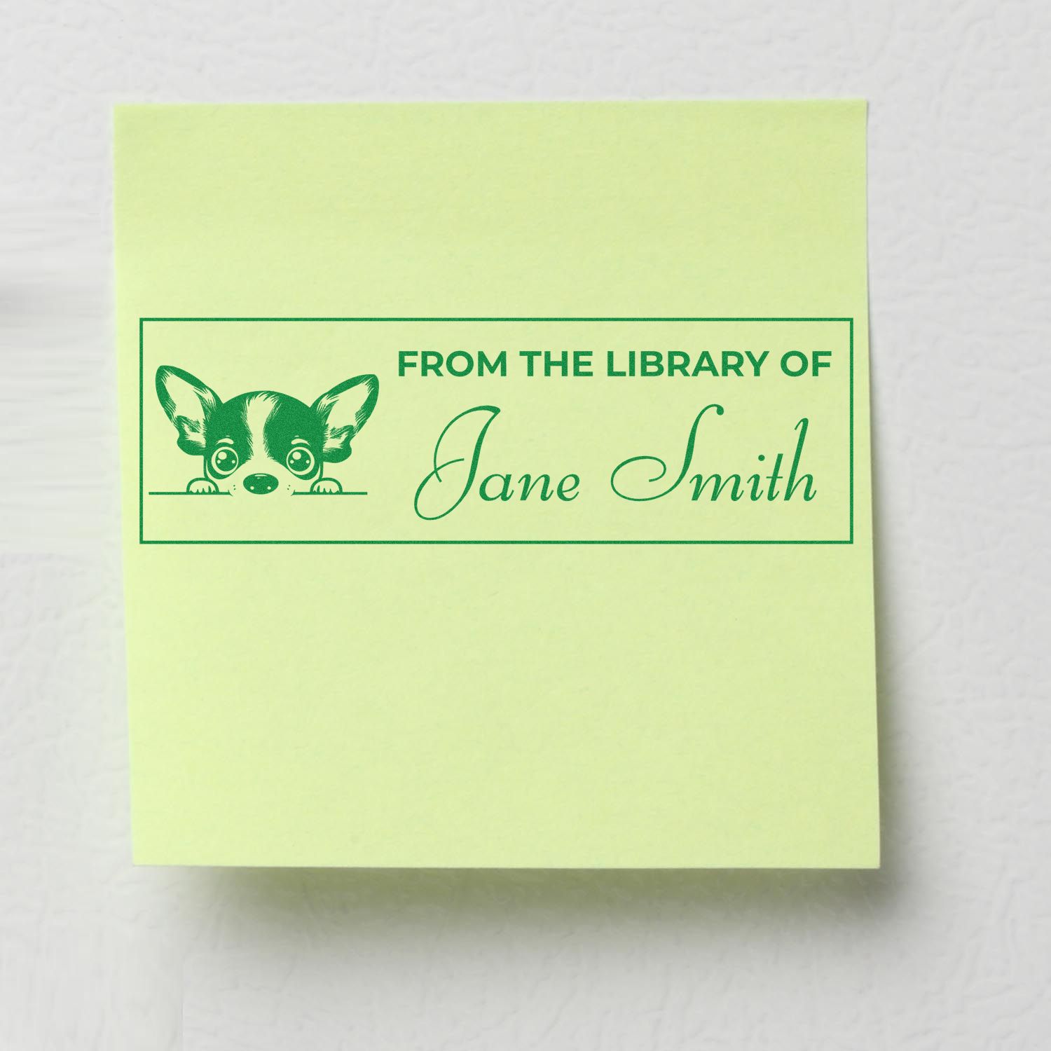 Personalized library rubber stamp reading From the Library of Jane Smith with cute dog bookplate design.
