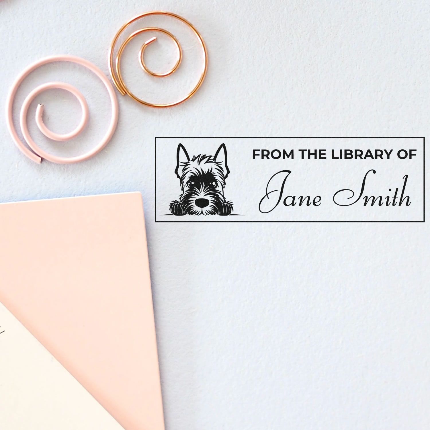 Custom library rubber stamp with dog illustration and Jane Smith name for personalized book ownership.