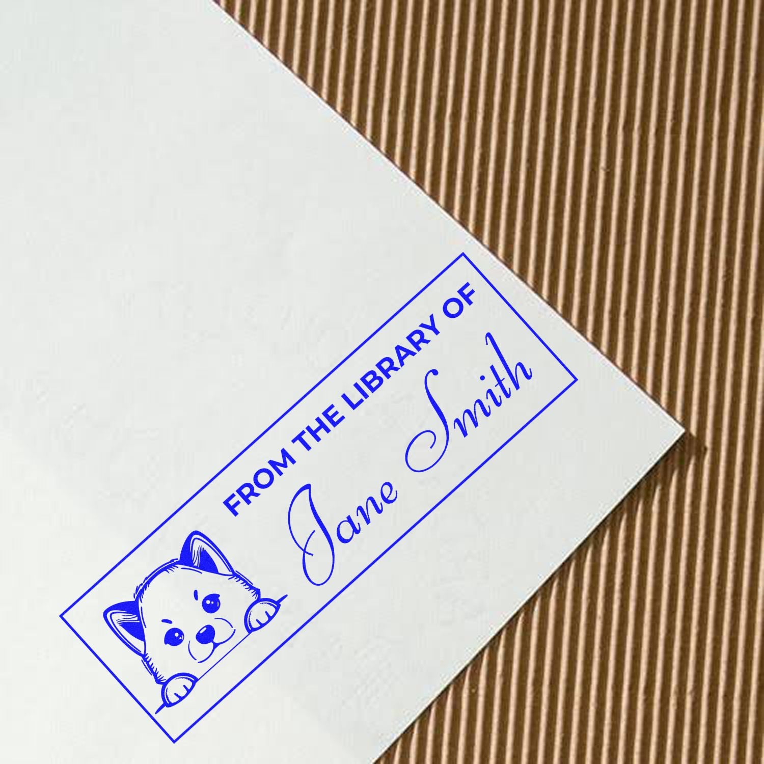 Personalized rubber stamp for books reading From the Library of Jane Smith with a dog illustration.