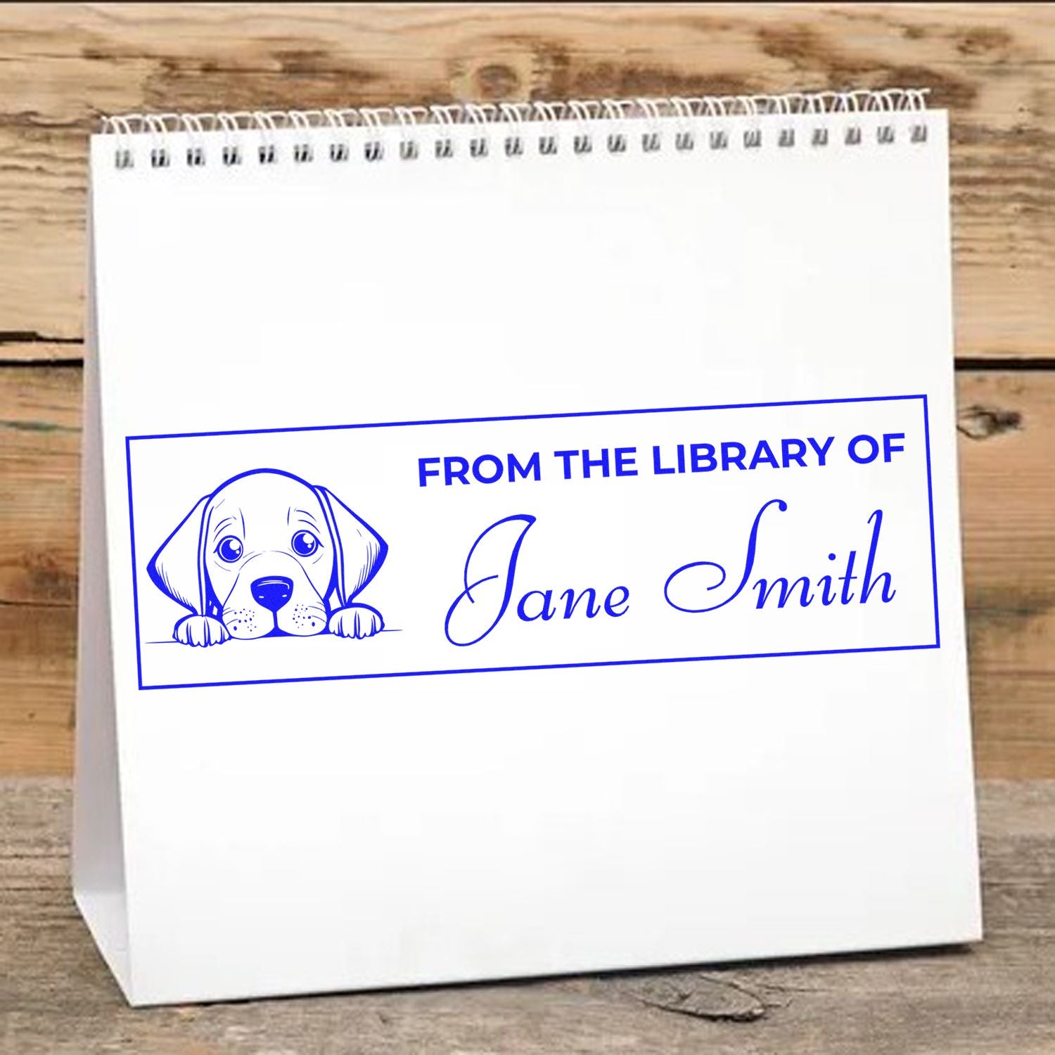 Custom From the Library of rubber stamp with puppy design and Jane Smith name, printed on a white gift bag.