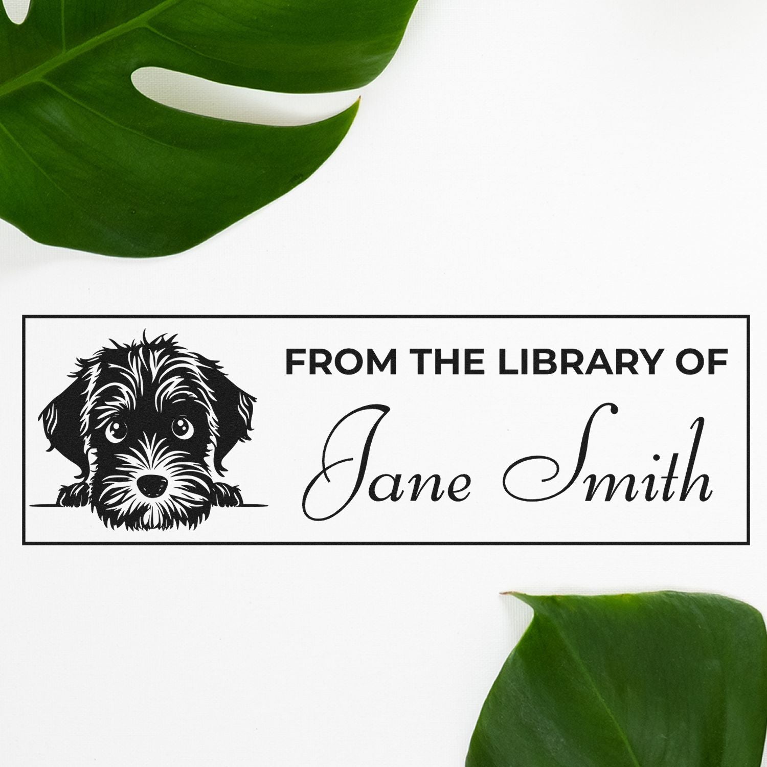 Custom library rubber stamp with dog illustration and From the Library of Jane Smith book ownership text.