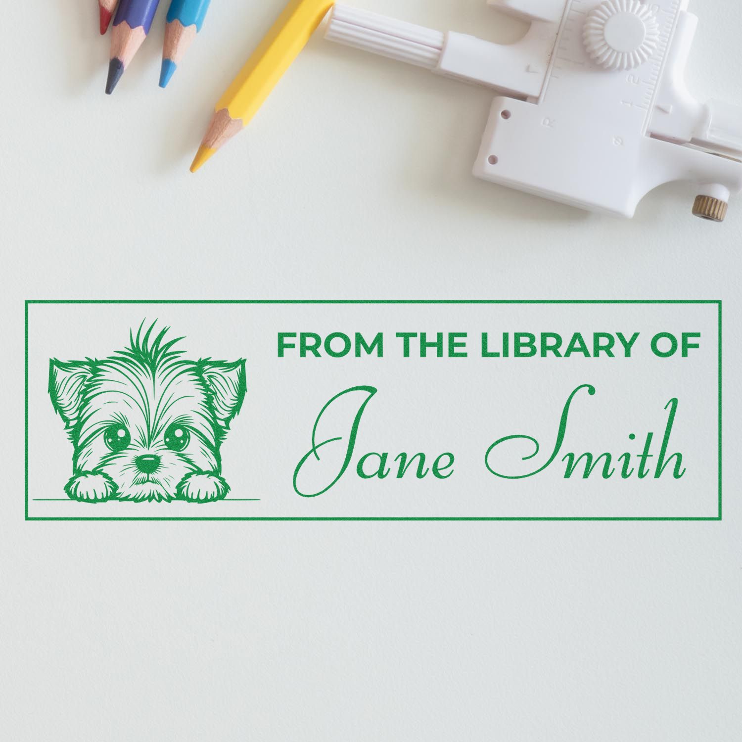 Custom rubber library stamp with dog illustration and From the Library of Jane Smith text for personal books.
