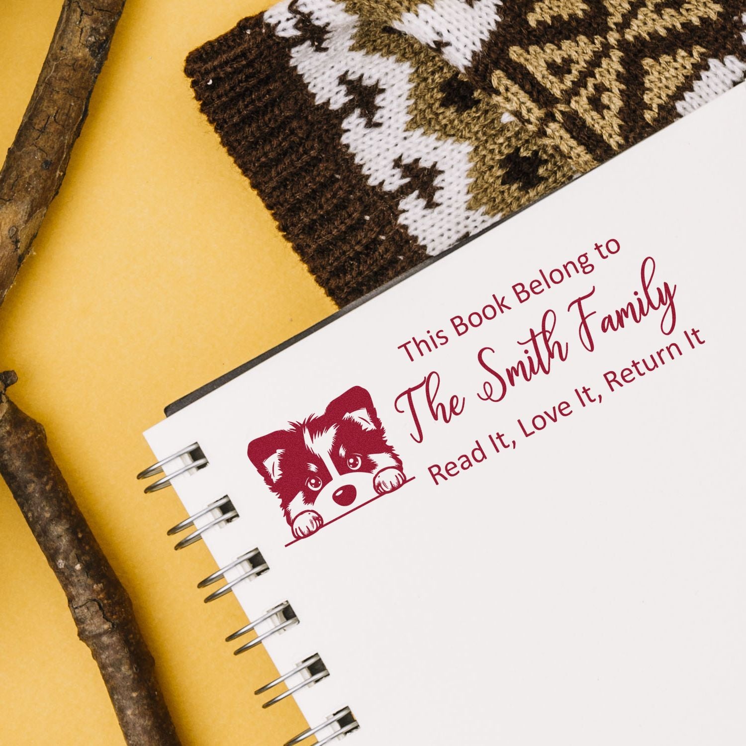 Personalized dog book rubber stamp for family libraries with This Book Belongs to The Smith Family return-it message.