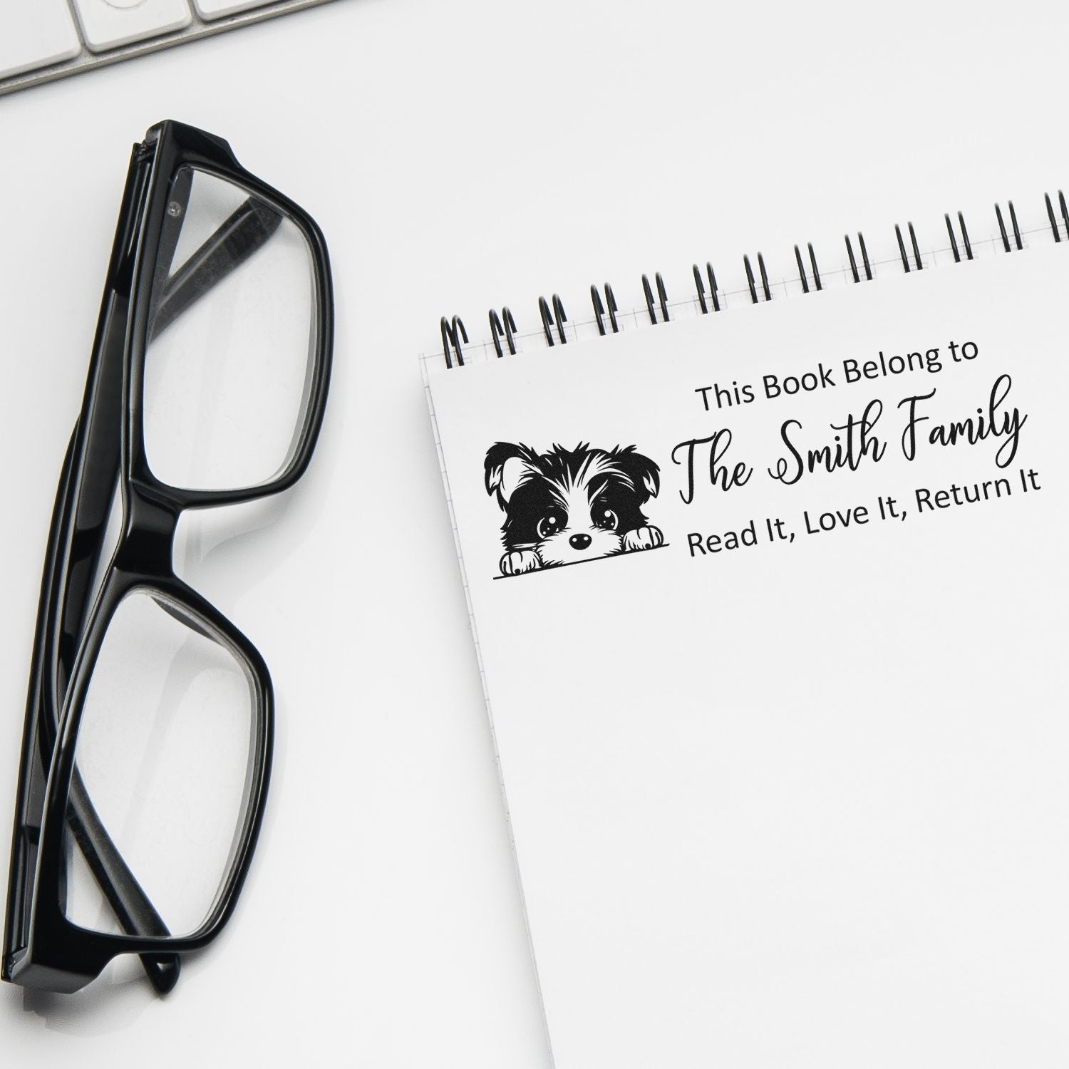 Personalized bookplate rubber stamp with puppy design for The Smith Family, marking books to read, love, and return.