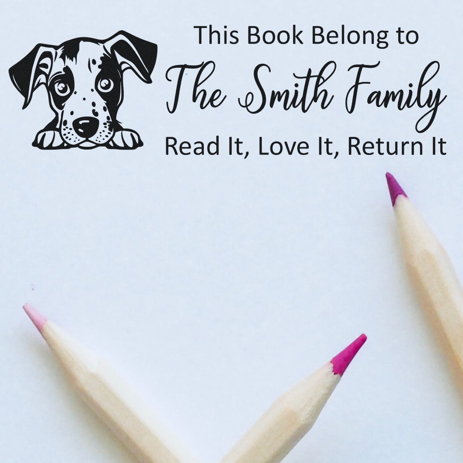 Personalized book return rubber stamp with puppy design and family name, "This Book Belongs to The Smith Family, Read It, Love It, Return It"
