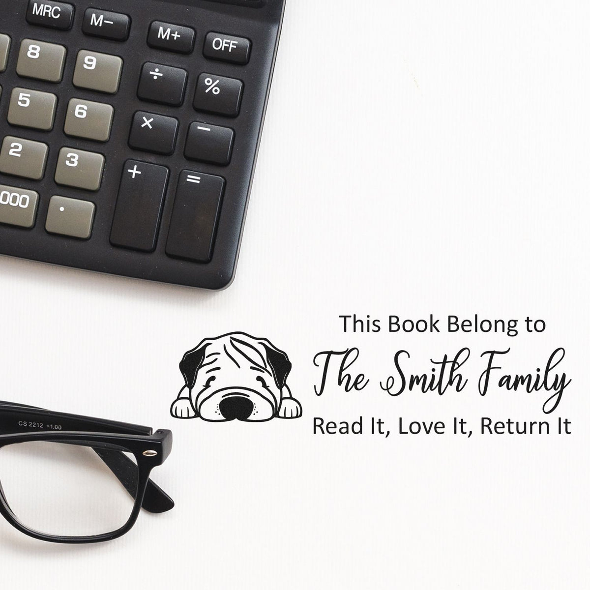 Custom rubber book stamp for The Smith Family with dog icon and Read It, Love It, Return It library ownership message.