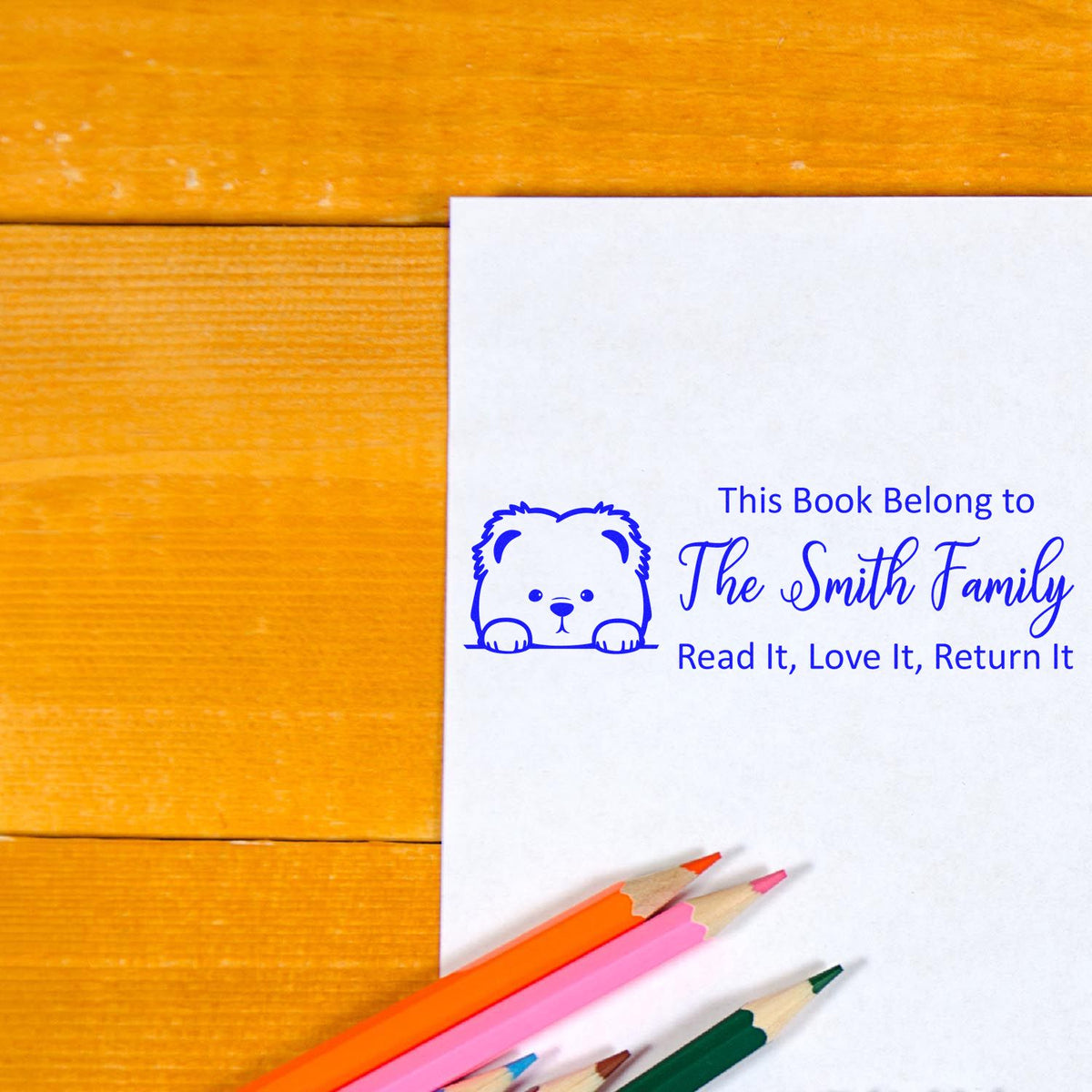 Personalized rubber book stamp for The Smith Family with bear design and Read It, Love It, Return It book ownership message.