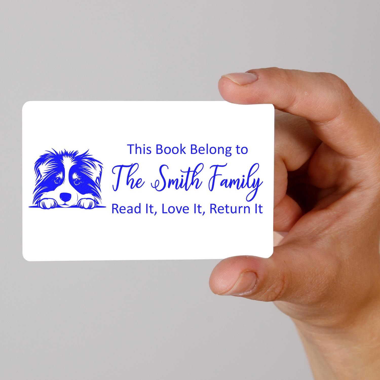 Personalized book stamp with dog design for The Smith Family, reading This Book Belongs To... Read It, Love It, Return It.
