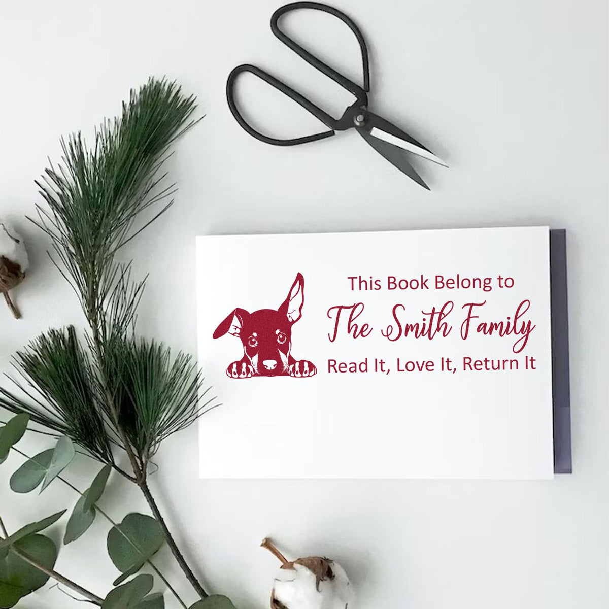 Custom book stamp with dog design and This Book Belong to The Smith Family return-it message for personal library books.