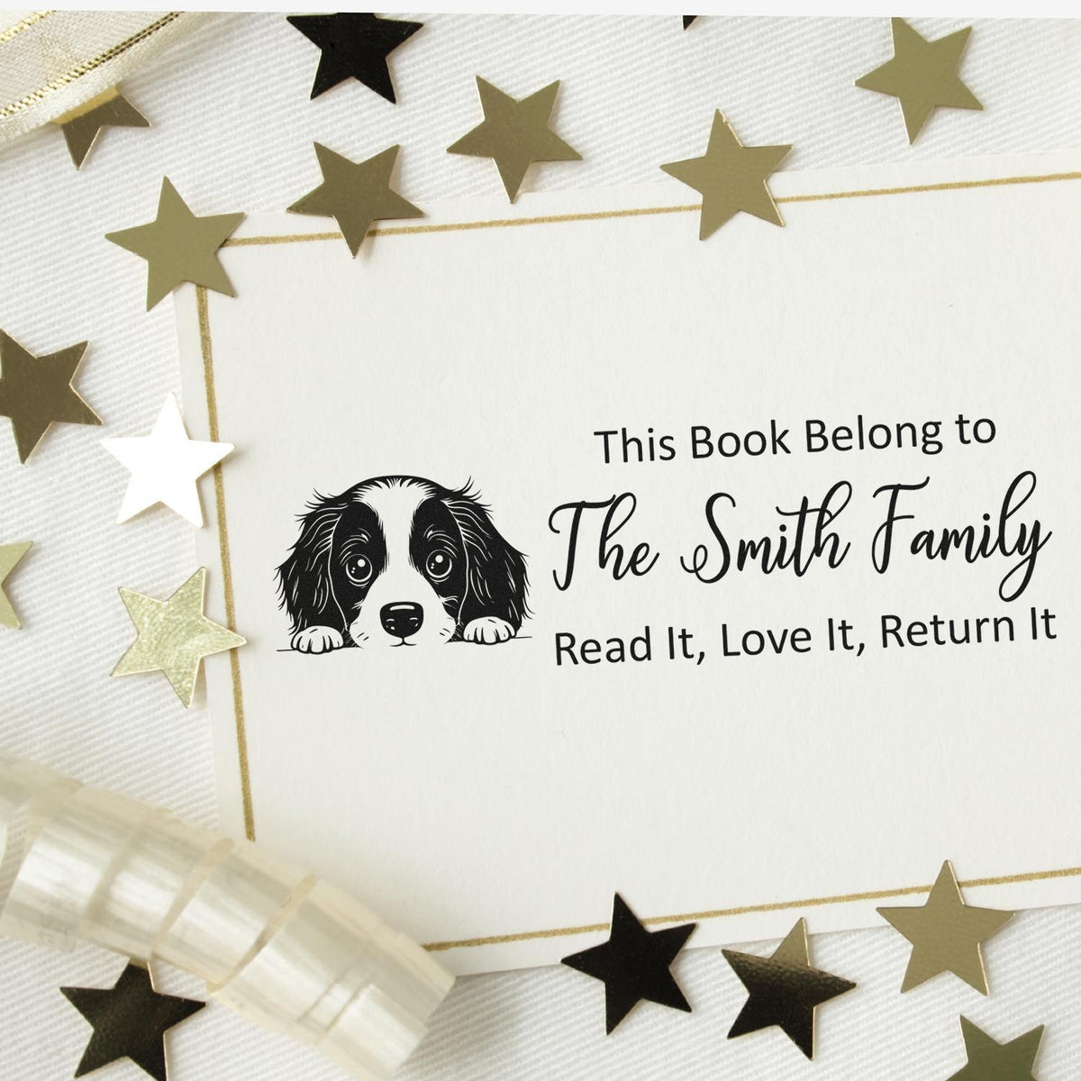 Personalized rubber book stamp with dog illustration and family name for custom ex libris bookplates