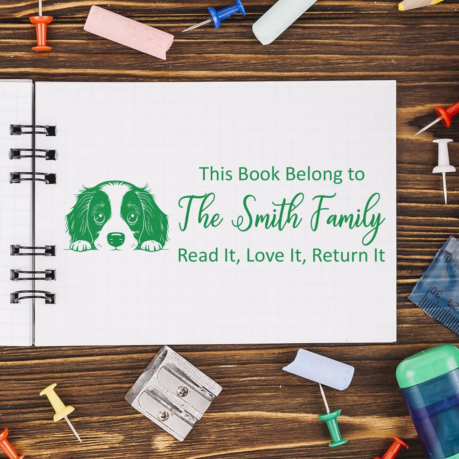 Personalized rubber book stamp for The Smith Family with dog design and Read It, Love It, Return It message.
