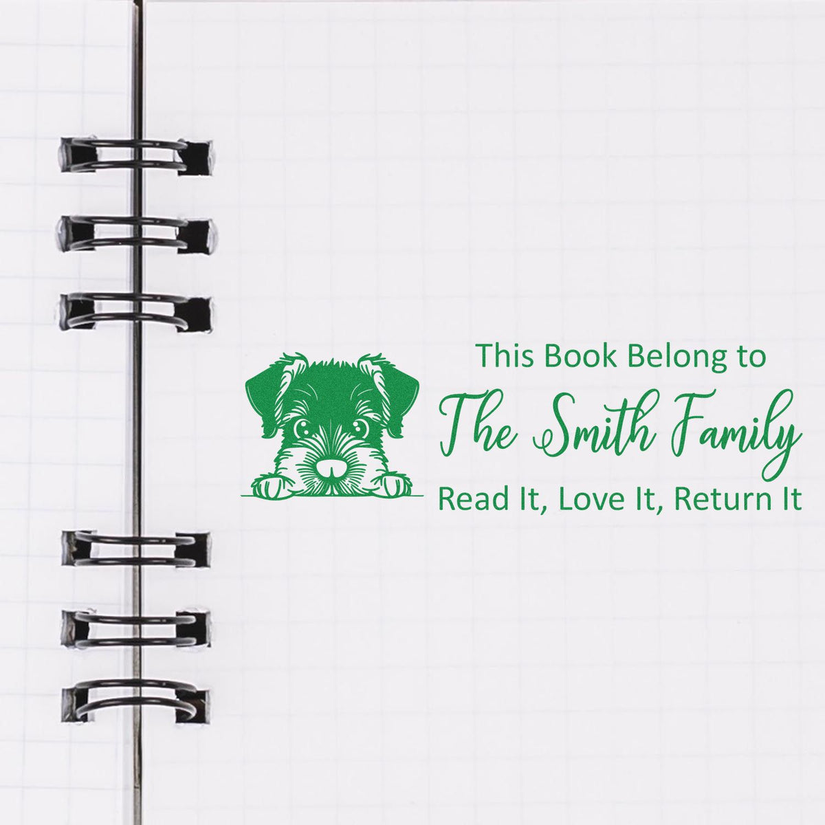 Custom rubber stamp bookplate with dog illustration and This Book Belong to The Smith Family text for personal libraries.
