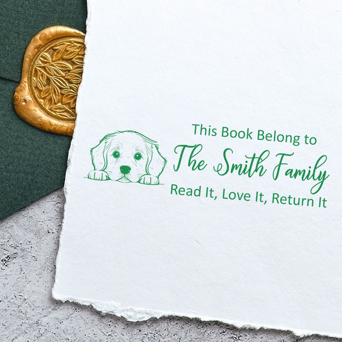 Personalized book rubber stamp with dog illustration and Read It, Love It, Return It family ownership message.