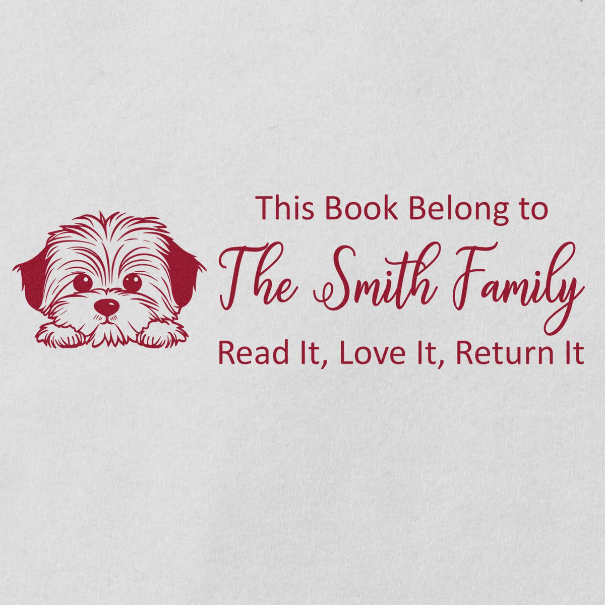 Custom rubber book stamp with dog illustration and The Smith Family bookplate text: Read It, Love It, Return It.