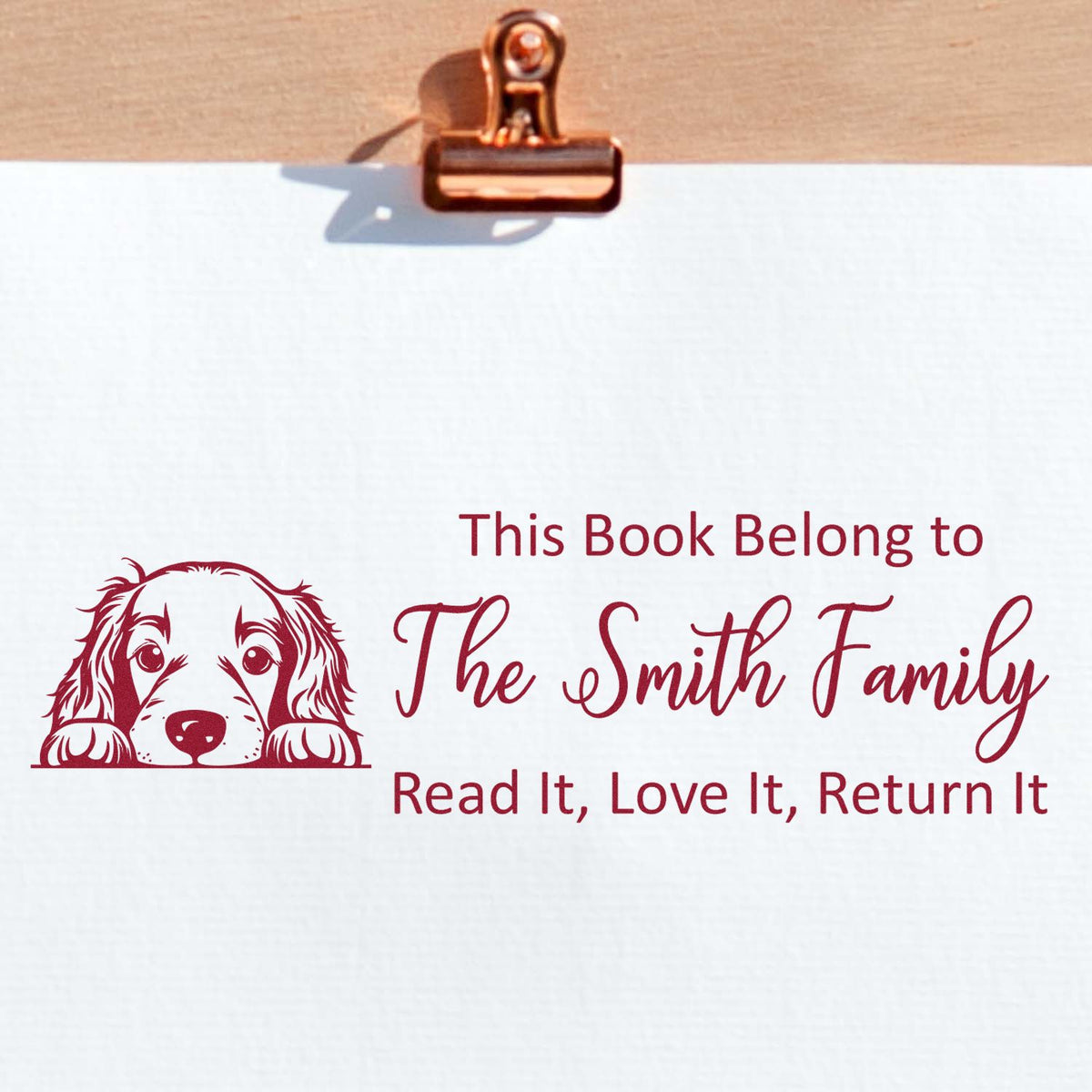 Personalized book stamp with dog design for The Smith Family; custom library ownership message, Read It, Love It, Return It.