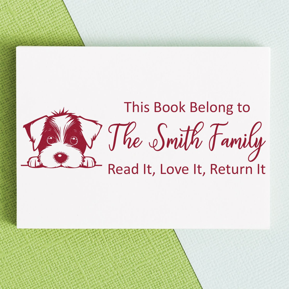 Personalized rubber stamp for books with dog illustration: This Book Belongs to The Smith Family, Read It, Love It, Return It.