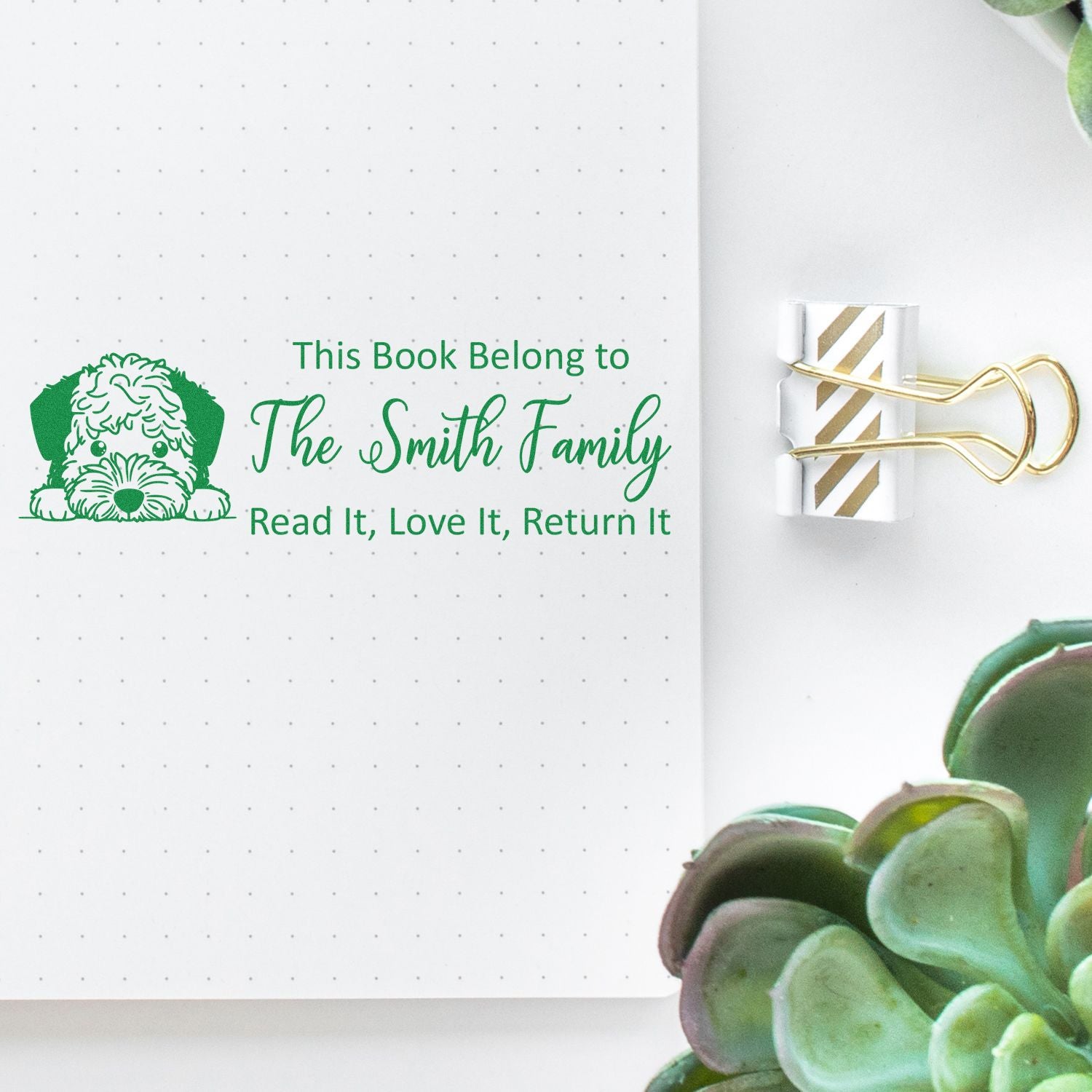 Personalized rubber book stamp with dog design and Read It, Love It, Return It family ex libris label.
