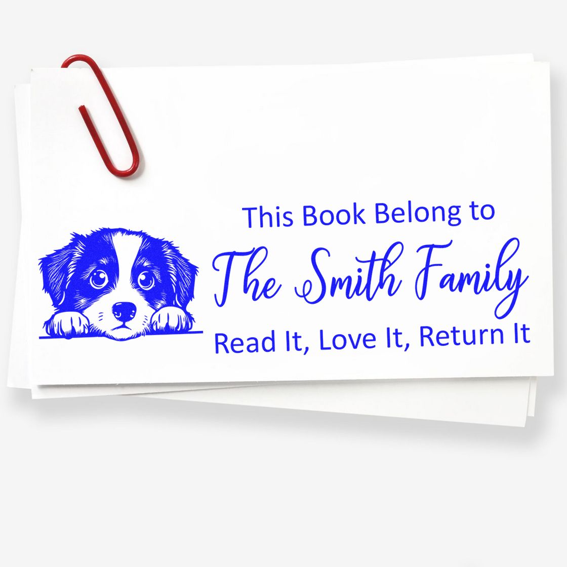 Personalized rubber book stamp for The Smith Family with puppy illustration and Read It, Love It, Return It text.