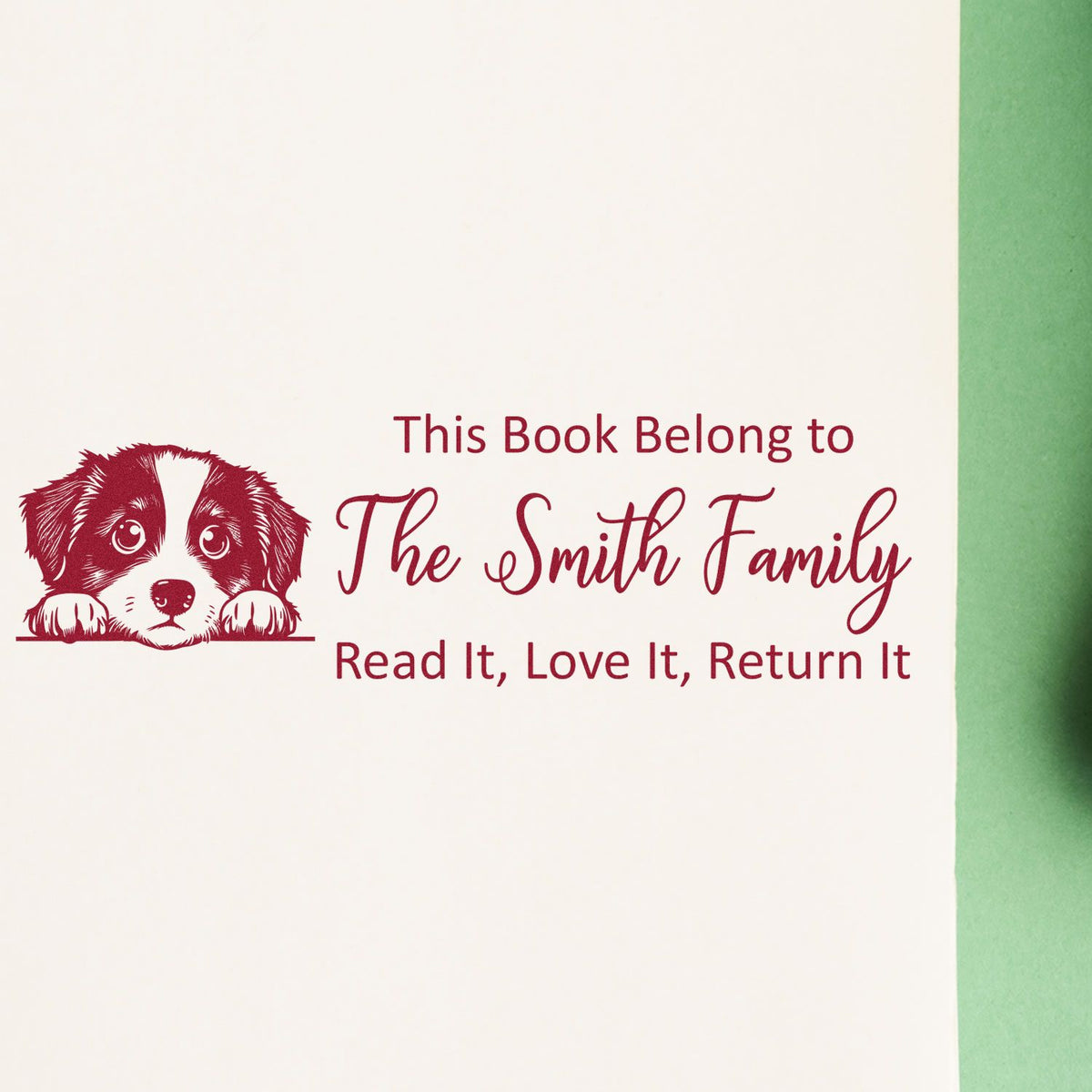 Custom rubber book stamp with puppy design for The Smith Family, marking books to read, love, and return.