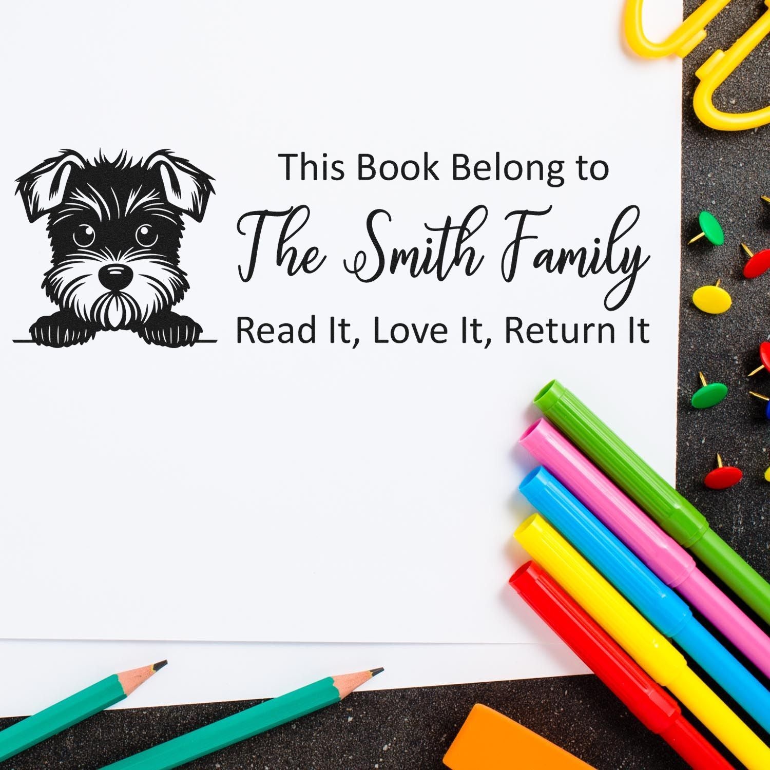 Custom rubber book stamp with dog design: This Book Belongs to The Smith Family, Read It, Love It, Return It.