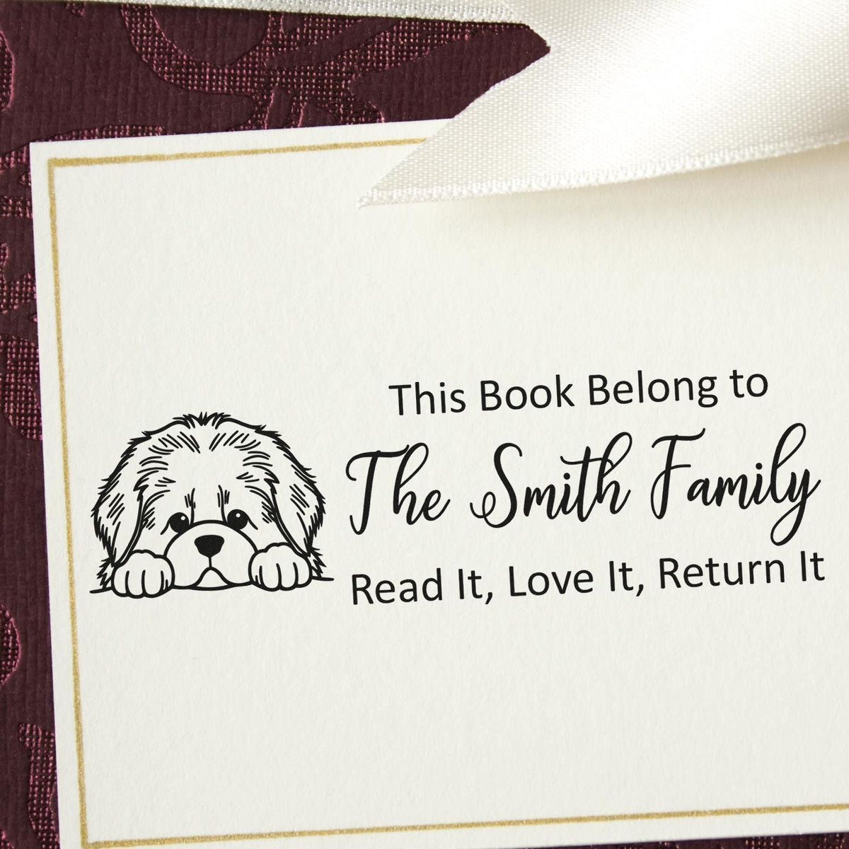 Custom rubber book stamp with dog illustration, personalized This Book Belongs to The Smith Family bookplate return label.