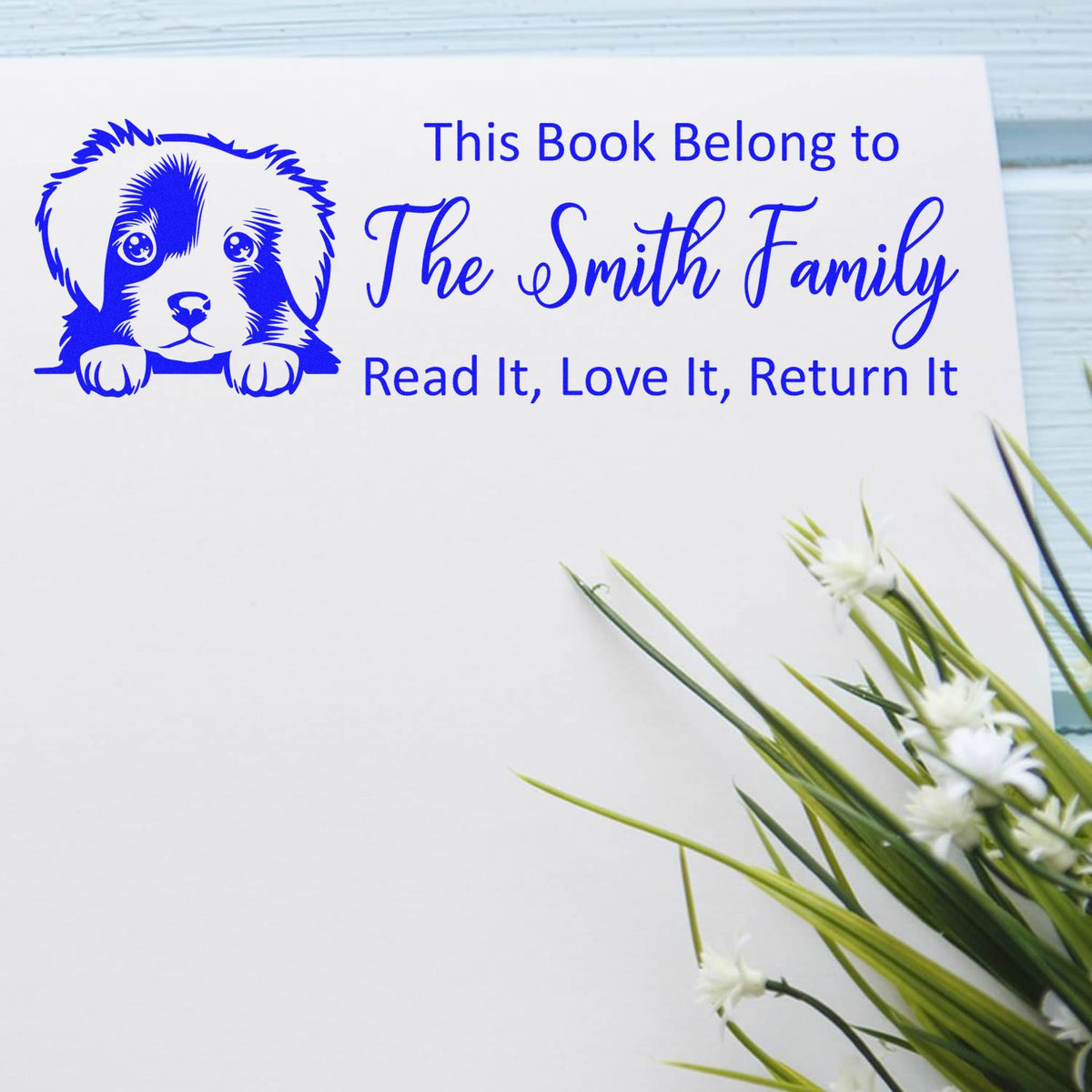 Personalized rubber book stamp with dog design for The Smith Family, featuring This Book Belongs To and Read It, Love It, Return It.