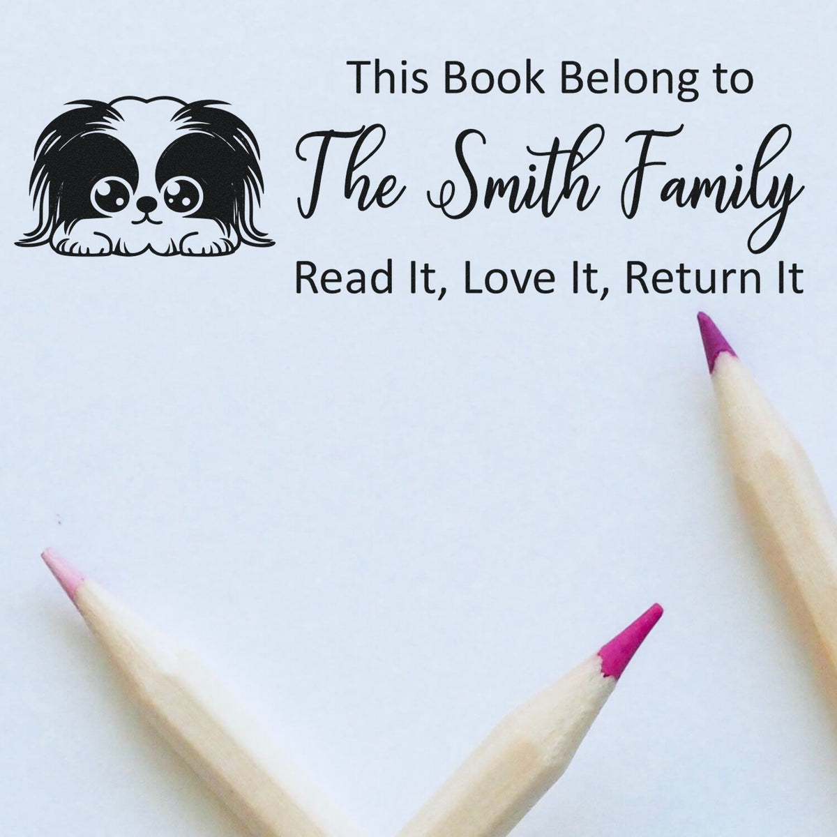 Custom rubber book stamp for The Smith Family, featuring a cute dog and Read It, Love It, Return It message.